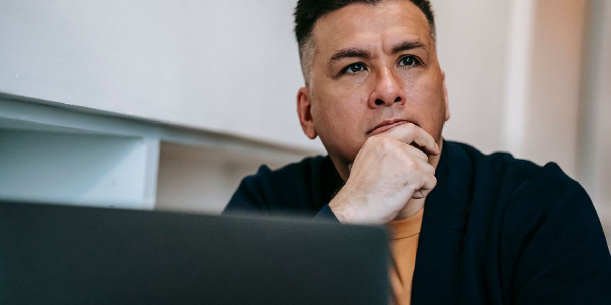 A bettor at a desk comparing a model projection against the posted price
